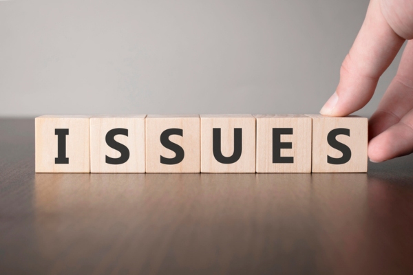 issues spelled using wooden letter blocks
