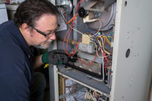 image of a furnace technician