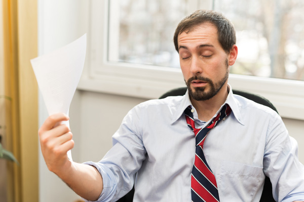 man dealing with a broken air conditioner