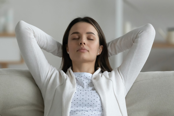 image of a woman enjoying clean indoor air quality at home