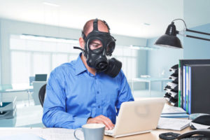 man wearing gas mask depicting indoor air pollution