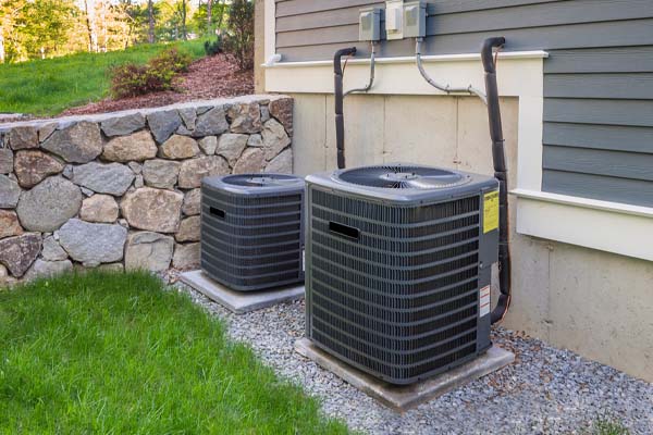 image of an outdoor air conditioning unit in summer
