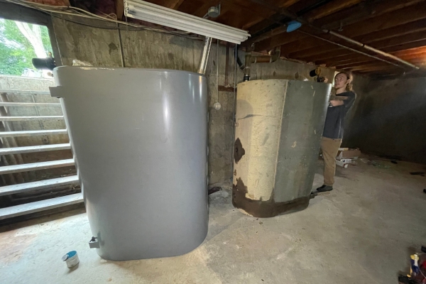 new and old heating oil tank side-by-side