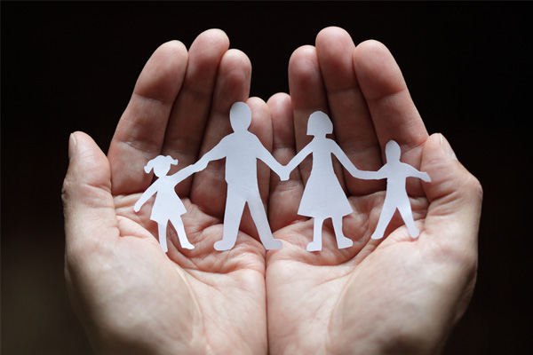 image of a paper cut family depicting furnace safety