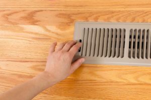 air conditioning vent with ac unit that is blowing smoke