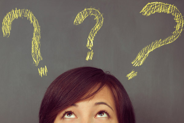 image of woman with question marks depicting why an air conditioner is not removing humidity