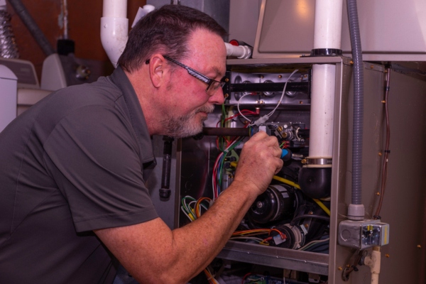 HVAC Tech Working on a Furnace