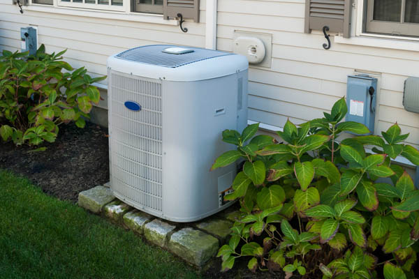 air conditioner condenser with landscaping nearby