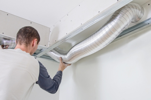 homeowner doing HVAC duct inspection