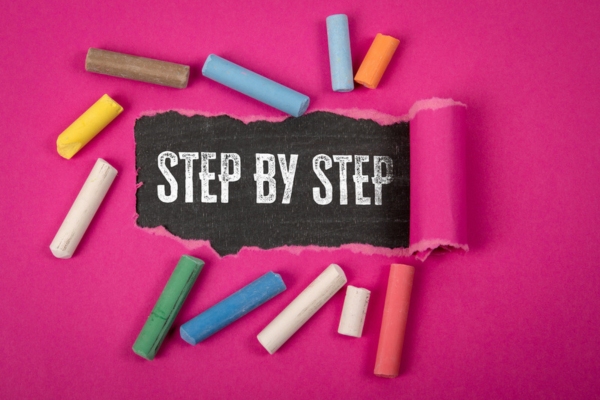 Step by step phrase revealed under torn purple paper depicting air filter replacement guide
