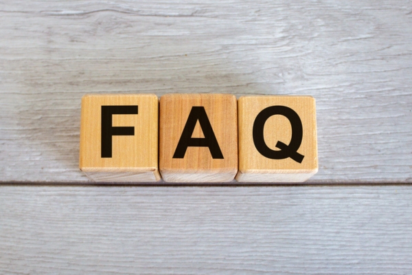 FAQ spelled using wooden letter blocks depicting furnace noise questions