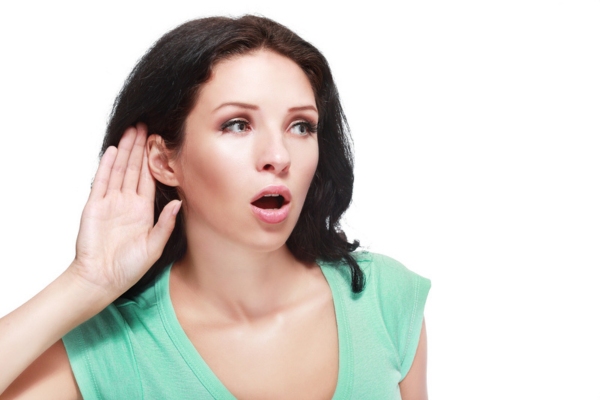 image of a listening woman to potential furnace sound source