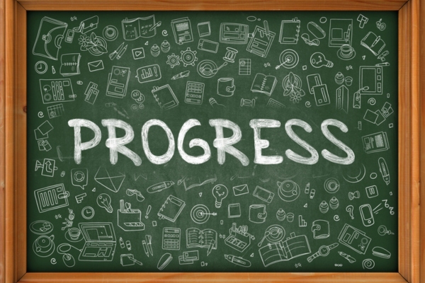 progress written on a chalkboard depicting Advancements in Oil Tank Design