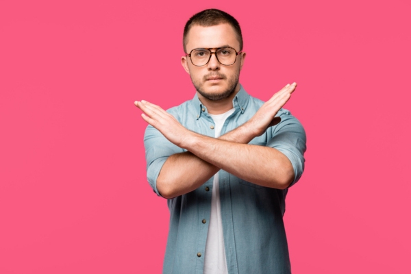 man crossing his arms doing a no gesture depicting HVAC Maintenance Is Not Optional