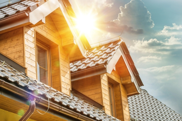 image of a sun shining so bright on top of house