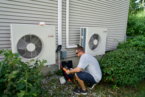 Miller Oil Company HVAC technician tending to outdoor air conditioner units